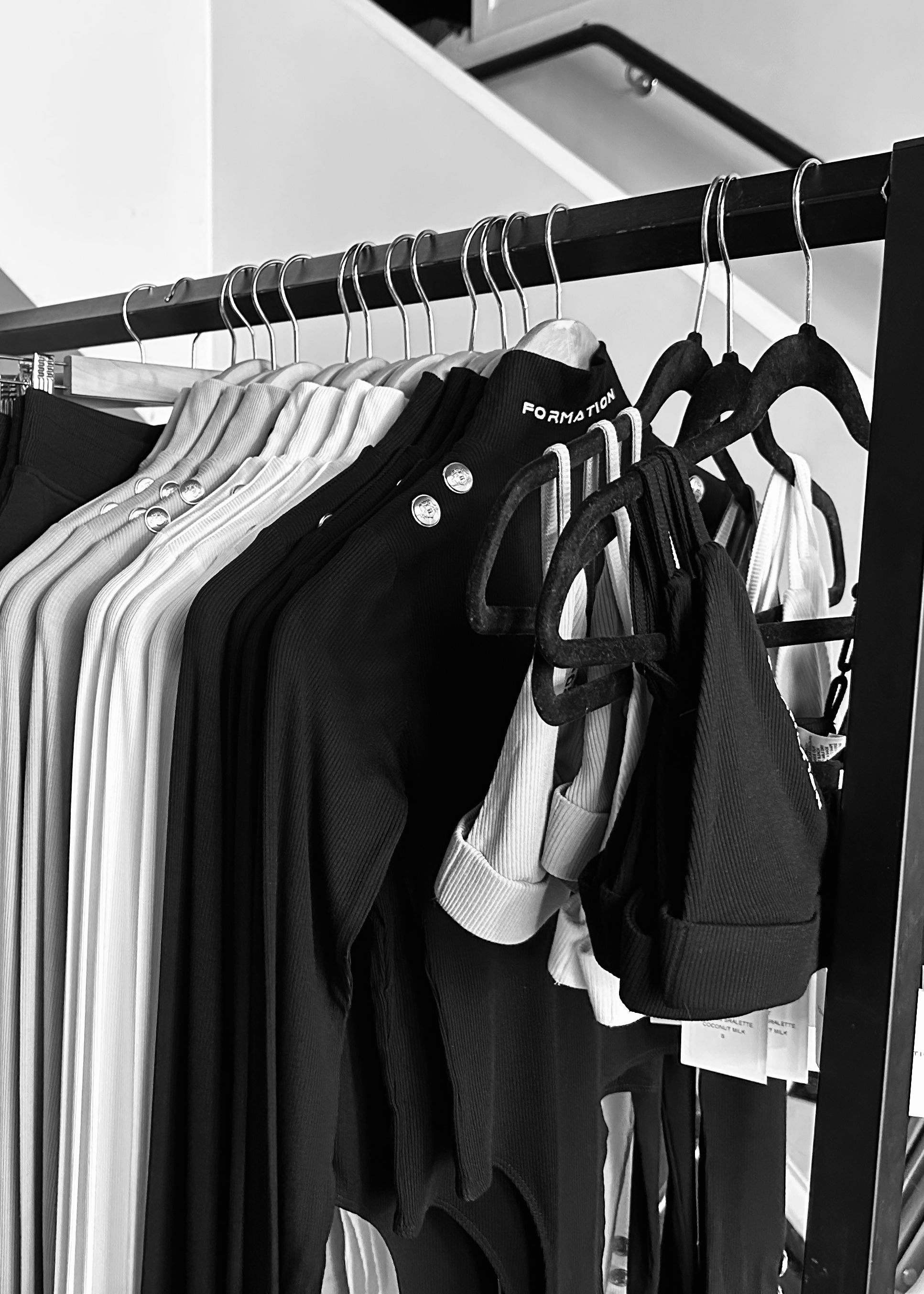 Black and white behind the scenes of clothing for photoshoot preparation
