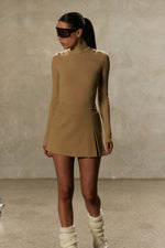 Model wearing Formation Desert Xya Skirt with soft pleat and gold-toned buttons